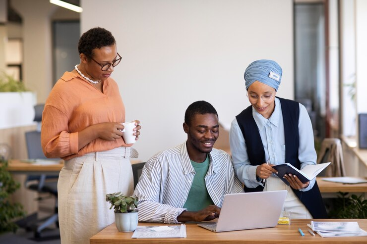 male-employee-getting-used-his-new-office-job-along-with-female-colleagues_23-2149034605